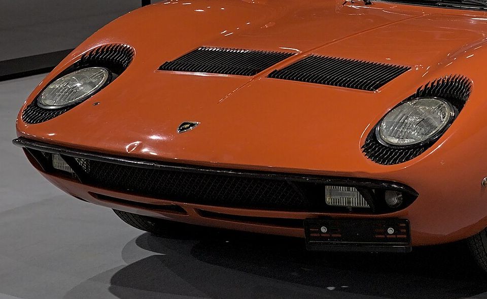 Close-up of the Lamborghini Miura’s front: headlamps, bonnet vents and the curve of the wings
